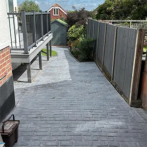 a suitcase is sitting on a brick walkway